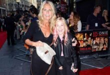 Ulrika Jonsson smiling on the red carpet with her daughter at a public movie premiere event.