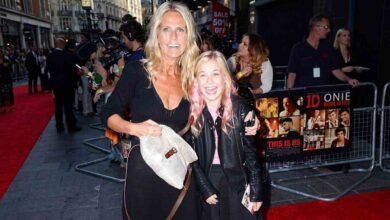 Ulrika Jonsson smiling on the red carpet with her daughter at a public movie premiere event.