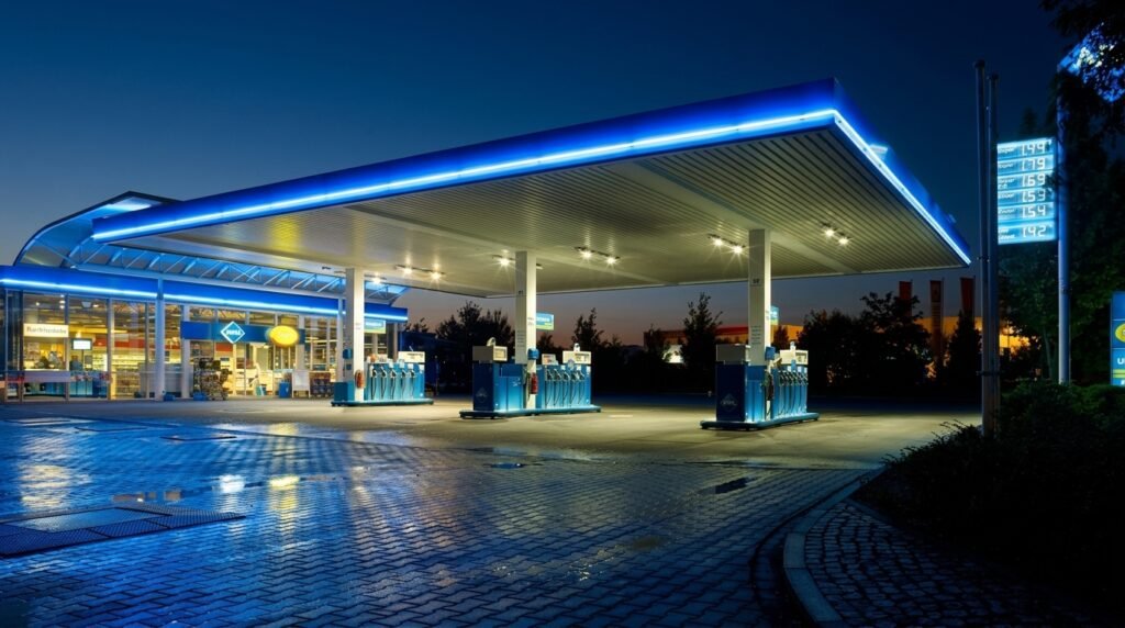 UK petrol station forecourt at night